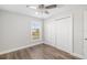 Bright bedroom with wood floors and double door closet at 1790 S Biscayne Dr, North Port, FL 34287