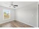 Spacious bedroom with wood floors and large window at 1790 S Biscayne Dr, North Port, FL 34287