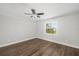 Bright bedroom with wood floors, ceiling fan and window at 1790 S Biscayne Dr, North Port, FL 34287
