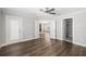 Spacious bedroom with wood floors and access to bathroom at 1790 S Biscayne Dr, North Port, FL 34287