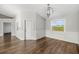 Bright dining room with wood floors and a chandelier at 1790 S Biscayne Dr, North Port, FL 34287