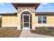 Front entrance with a screened porch and walkway at 1790 S Biscayne Dr, North Port, FL 34287