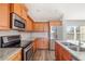 Modern kitchen with stainless steel appliances and granite countertops at 1790 S Biscayne Dr, North Port, FL 34287