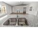 Double stainless steel sink with modern faucet in granite countertop at 1790 S Biscayne Dr, North Port, FL 34287