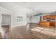 Open living room and kitchen with hardwood floors and high ceilings at 1790 S Biscayne Dr, North Port, FL 34287