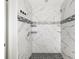 Large walk-in shower with marble tile and pebble floor at 1790 S Biscayne Dr, North Port, FL 34287
