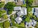 Bird's eye view of a modern home with a pool and lush landscaping at 1804 N Lake Shore Dr, Sarasota, FL 34231