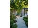 Landscaped garden path with stone and lush greenery at 1804 N Lake Shore Dr, Sarasota, FL 34231