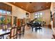 Elegant living room with a grand piano and high ceilings at 1804 N Lake Shore Dr, Sarasota, FL 34231
