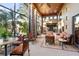 Relaxing sunroom with ample seating and screened windows at 1804 N Lake Shore Dr, Sarasota, FL 34231