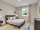 Comfortable bedroom with double bed and window at 2219 Greenley Rd, North Port, FL 34286