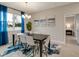 Bright dining room features a dark wood table and blue accents at 2219 Greenley Rd, North Port, FL 34286