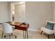 Functional home office with wood desk and built-in shelving at 2219 Greenley Rd, North Port, FL 34286