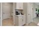 Kitchen nook with white cabinets and coffee bar at 2219 Greenley Rd, North Port, FL 34286