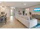 Open concept living room looking toward the kitchen and entry at 2219 Greenley Rd, North Port, FL 34286