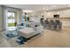 Open concept living room with sectional sofa and kitchen views at 2219 Greenley Rd, North Port, FL 34286