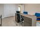 Modern home office with large desk and office chair at 2219 Greenley Rd, North Port, FL 34286