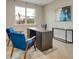 Home office with desk and two blue chairs at 2219 Greenley Rd, North Port, FL 34286