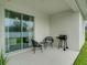 Relaxing patio with seating area and grill at 2219 Greenley Rd, North Port, FL 34286