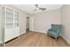 Bedroom with a teal accent chair and built-in shelving at 2415 Midnight Pearl Dr, Sarasota, FL 34240