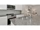 Sleek kitchen with stainless steel sink and granite countertop at 2415 Midnight Pearl Dr, Sarasota, FL 34240