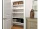 Well-organized linen closet with ample shelving for storage at 2415 Midnight Pearl Dr, Sarasota, FL 34240