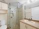 Bathroom with glass shower and updated vanity at 25100 Sandhill Blvd # 102, Punta Gorda, FL 33983