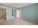 Bedroom with access to bathroom and mirrored closet at 25100 Sandhill Blvd # 102, Punta Gorda, FL 33983