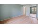 Bedroom with mirrored closet doors and wood-look floors at 25100 Sandhill Blvd # 102, Punta Gorda, FL 33983