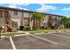 Two-story condo building with parking and landscaping at 25100 Sandhill Blvd # 102, Punta Gorda, FL 33983