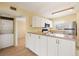 Kitchen with white cabinets and laminate countertops at 25100 Sandhill Blvd # 102, Punta Gorda, FL 33983
