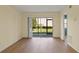Living room with sliding glass doors leading to a patio at 25100 Sandhill Blvd # 102, Punta Gorda, FL 33983