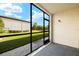 Screened patio overlooking a grassy backyard area at 25100 Sandhill Blvd # 102, Punta Gorda, FL 33983