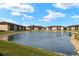 Community features a serene pond with lush landscaping at 25100 Sandhill Blvd # 102, Punta Gorda, FL 33983