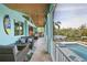 Relaxing covered patio with outdoor seating and water view at 262 Island Cir, Sarasota, FL 34242