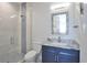 Small bathroom with a single vanity, marble countertop, and a modern shower at 262 Island Cir, Sarasota, FL 34242