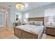 Bright bedroom with a king-size bed, light wood furniture, and natural light at 262 Island Cir, Sarasota, FL 34242