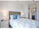 Cozy bedroom with a full-size bed, stylish bedding, and ample natural light at 262 Island Cir, Sarasota, FL 34242