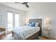 Inviting bedroom with a gray bed, coastal-themed bedding, and shiplap wall at 262 Island Cir, Sarasota, FL 34242