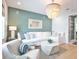 Bright living room featuring shiplap accent wall, coastal decor, and a modern chandelier at 262 Island Cir, Sarasota, FL 34242