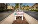 Pinewood Village entrance sign, welcoming residents and guests to the community at 2782 Woodgate Ln # 18, Sarasota, FL 34231