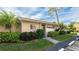Attractive exterior of condo with well-maintained landscaping at 2782 Woodgate Ln # 18, Sarasota, FL 34231