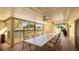 Community patio with a long table and chairs, offering a shaded outdoor space at 2782 Woodgate Ln # 18, Sarasota, FL 34231
