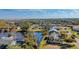 Aerial view of a waterfront home, showcasing its private backyard and serene water views at 309 South Dr, Nokomis, FL 34275