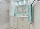 Modern bathroom features a glass-enclosed shower, stylish vanity, and sleek contemporary design at 309 South Dr, Nokomis, FL 34275