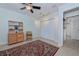 Bright bedroom with a ceiling fan, track lighting, and a large closet at 309 South Dr, Nokomis, FL 34275