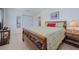 Inviting bedroom features a carved wood bed frame and cozy decor for a comfortable retreat at 309 South Dr, Nokomis, FL 34275