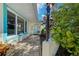 Charming home with a blue front door and lush landscaping creating a warm, inviting entrance at 309 South Dr, Nokomis, FL 34275