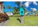 Charming home with a cute library box set in the landscaped front yard at 309 South Dr, Nokomis, FL 34275
