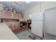 Spacious garage features ample storage cabinets and a full sized refrigerator at 309 South Dr, Nokomis, FL 34275